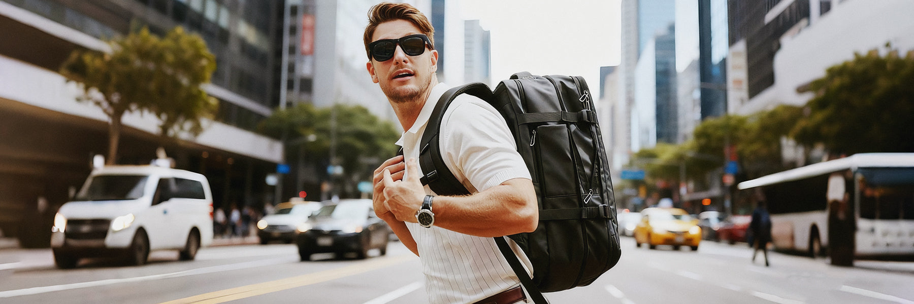 Mark Ryden black anti-theft backpack worn by man in busy city street for modern travelers