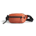 Terracotta orange AeroSling Ultra-Light Anti-Theft Crossbody Bag with black zippers, adjustable strap, and RFID-safe technology for secure travel.