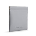 Light gray Mark Ryden coin pouch with smooth texture, metal clip, and secure design for effortless valuables carry.