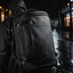 Mark Ryden Global Aegis Fortress 38L all-weather backpack shown in rainy urban setting