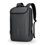 Dark gray MarkRyden Compacto Pro backpack with futuristic design, multiple zippered compartments, USB charging port, and large capacity for daily use.