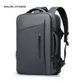 Mark Ryden Expandos gray expandable laptop backpack with front zipper, side compartments, padded straps, and USB port for all-day travel.